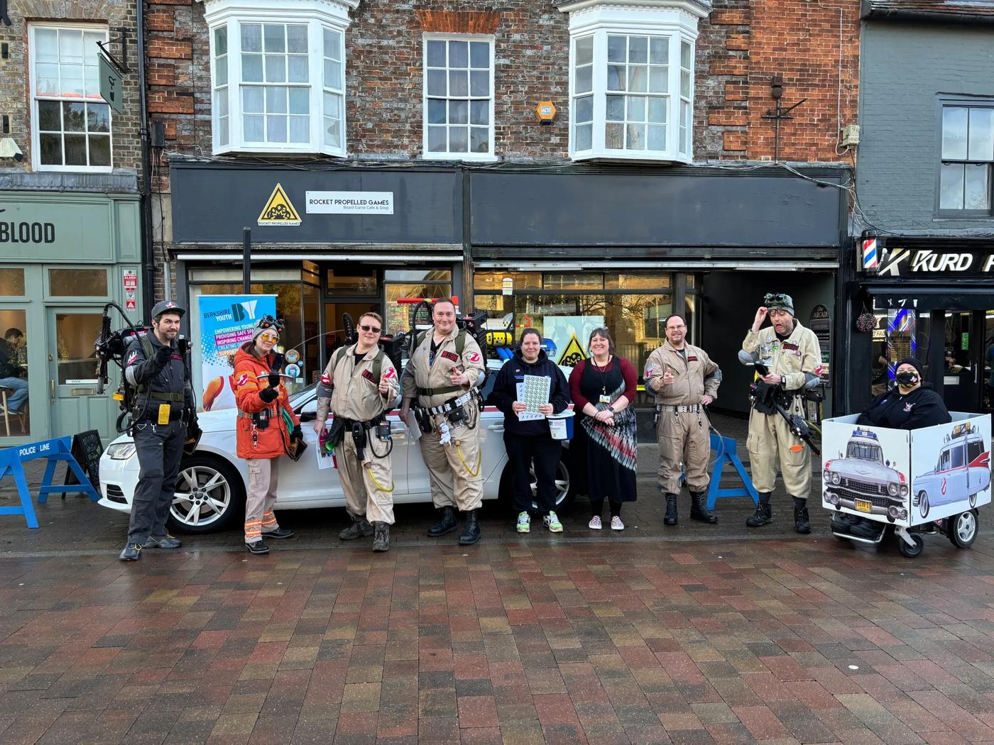 The Rocket Propelled Games shopfront on Bartholomew Street with the Berkshire Busters in Ghostbusters costume and Berkshire Youth